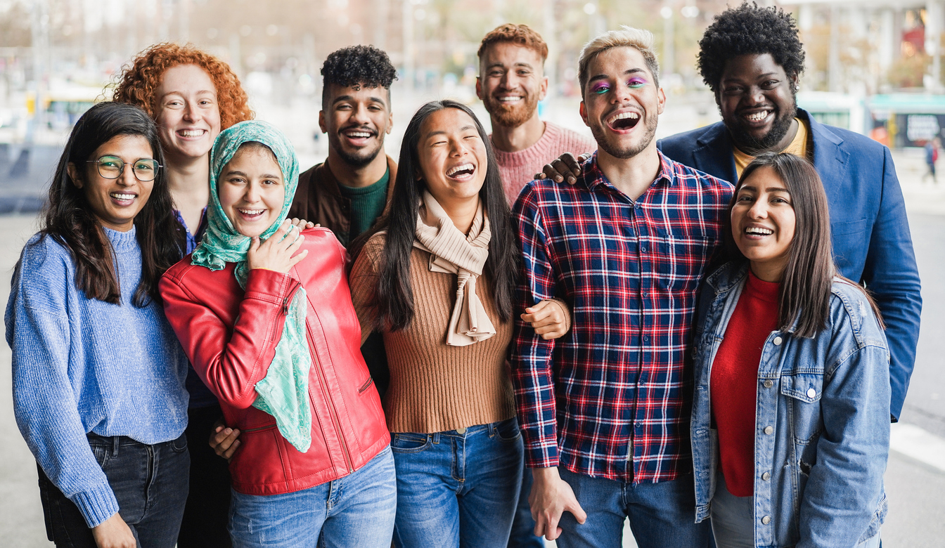 Young diverse people having fun outdoor laughing together - Diversity concept - Main focus on gay man face